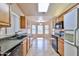 Functional kitchen featuring ample counter space, wood cabinets, and modern appliances at 8347 W Taro Ln, Peoria, AZ 85382