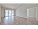 Bright and airy living room with tile flooring and sliding glass doors to the outdoor area at 8347 W Taro Ln, Peoria, AZ 85382