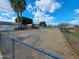 Extensive backyard enclosed by chain-link fencing at 8350 W Monroe St, Peoria, AZ 85345