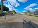 Large backyard featuring mature trees and chain-link fence at 8350 W Monroe St, Peoria, AZ 85345