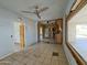 Living room with original tile floors, awaiting upgrades to maximize its potential appeal at 8350 W Monroe St, Peoria, AZ 85345