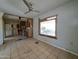 Living room featuring views to the kitchen, awaiting renovation to maximize its potential appeal at 8350 W Monroe St, Peoria, AZ 85345