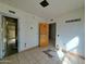 Spacious living room featuring tile flooring and natural light at 8350 W Monroe St, Peoria, AZ 85345