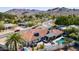 Aerial view of property highlighting a terracotta tile roof, pool, and outdoor entertaining area with mountain views at 9234 N 33Rd Way, Phoenix, AZ 85028