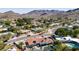 This neighborhood aerial showcases a pool, desert landscape, and mountain views at 9234 N 33Rd Way, Phoenix, AZ 85028