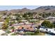 This aerial view shows a desert home and pool, featuring mountain views at 9234 N 33Rd Way, Phoenix, AZ 85028