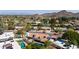 Beautiful aerial view of a home featuring a tiled roof, backyard pool, and mountain views at 9234 N 33Rd Way, Phoenix, AZ 85028