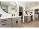 This bathroom features dual sinks, modern fixtures, and mirrors at 9234 N 33Rd Way, Phoenix, AZ 85028