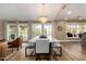 Elegant dining space featuring modern table with island view and outdoor pool at 9234 N 33Rd Way, Phoenix, AZ 85028