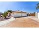 Home with a three-car garage, desert landscaping, and an extended driveway at 9234 N 33Rd Way, Phoenix, AZ 85028