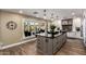 Well-lit kitchen island with open window and adjacent seating area at 9234 N 33Rd Way, Phoenix, AZ 85028