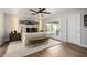 A spacious main bedroom features modern decor, a ceiling fan, and sliding glass doors to the backyard at 9234 N 33Rd Way, Phoenix, AZ 85028