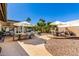 Large patio with multiple seating areas and desert landscaping create an inviting outdoor space at 9234 N 33Rd Way, Phoenix, AZ 85028