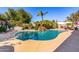 Beautiful backyard pool area, complete with rock waterfall, lounge area and desert landscaping at 9234 N 33Rd Way, Phoenix, AZ 85028