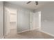 Bedroom featuring walk-in closet, plush carpet, and neutral paint at 9413 W Pioneer St, Tolleson, AZ 85353