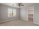 Bright bedroom featuring a large window offering ample natural light at 9413 W Pioneer St, Tolleson, AZ 85353