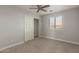 Bedroom featuring neutral carpet, and a closet with bi-fold doors at 9413 W Pioneer St, Tolleson, AZ 85353