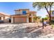 Charming two-story home with a well-maintained front yard and a spacious two car garage at 9413 W Pioneer St, Tolleson, AZ 85353