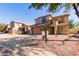 Charming two-story home featuring a low maintenance front yard and inviting curb appeal at 9413 W Pioneer St, Tolleson, AZ 85353