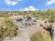 Attractive aerial view of a stylish home showcasing solar panels, lush landscaping, and ample parking at 1001 N 165Th Ave, Goodyear, AZ 85338