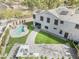 Aerial view of the backyard featuring a lush pool and a well-equipped outdoor kitchen at 1001 N 165Th Ave, Goodyear, AZ 85338