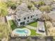 Aerial view of the house and a private pool, complemented by a green backyard at 1001 N 165Th Ave, Goodyear, AZ 85338