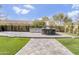 Outdoor kitchen with a concrete island, built-in grill, and ample seating in a landscaped backyard at 1001 N 165Th Ave, Goodyear, AZ 85338