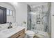 Well-lit bathroom features a marble shower, updated fixtures, and stylish vanity at 1001 N 165Th Ave, Goodyear, AZ 85338