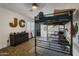 Neutral bedroom with a large bunk bed and decorative elements at 1001 N 165Th Ave, Goodyear, AZ 85338