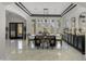 An elegant dining room boasting marble floors, refined decor, and a stylish contemporary dining set at 1001 N 165Th Ave, Goodyear, AZ 85338