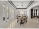 Bright and airy dining room features elegant marble floors, a modern chandelier, and stylish decor at 1001 N 165Th Ave, Goodyear, AZ 85338