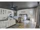 Bright main bedroom suite featuring a ceiling fan, sitting area, and large windows at 1001 N 165Th Ave, Goodyear, AZ 85338