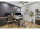 Modern office features a wood desk, accent wall, and decor creating a functional workspace at 1001 N 165Th Ave, Goodyear, AZ 85338