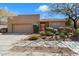 Charming single-story home with desert landscaping, a two car garage, and a gated courtyard at 11489 N 141St St, Scottsdale, AZ 85259