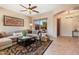 Cozy living room with area rug and a large window offering lots of natural light at 11489 N 141St St, Scottsdale, AZ 85259