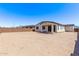 Expansive backyard with ample space and potential for customization, bordered by a block wall for privacy at 12374 W Marguerite Ave, Avondale, AZ 85323