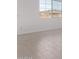 Bright and airy bedroom with natural light streaming through a large window at 12374 W Marguerite Ave, Avondale, AZ 85323