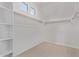 Walk-in closet with built-in shelving and ample hanging space, perfect for organization at 12374 W Marguerite Ave, Avondale, AZ 85323