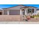 Charming single-story home featuring a three-car garage, desert landscaping, and a neutral color palette at 12374 W Marguerite Ave, Avondale, AZ 85323