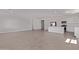 Expansive living area featuring an open floor plan, modern lighting, and neutral color scheme at 12374 W Marguerite Ave, Avondale, AZ 85323