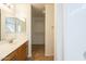 Bathroom featuring a white sink and vanity and access to the shower and closet at 13011 W Mandalay Ln, El Mirage, AZ 85335