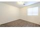 Bright bedroom with wood flooring and a window with coverings at 13011 W Mandalay Ln, El Mirage, AZ 85335