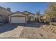 Charming single-story home featuring a well-maintained front yard and attached two-car garage at 13011 W Mandalay Ln, El Mirage, AZ 85335