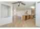 Open-concept kitchen with wooden cabinets, stainless steel appliances, and a breakfast bar at 13011 W Mandalay Ln, El Mirage, AZ 85335