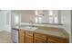 Kitchen area featuring granite countertops, stainless steel dishwasher, and white ceramic sink at 13011 W Mandalay Ln, El Mirage, AZ 85335