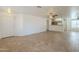 Spacious living room featuring neutral walls, tile flooring, and a ceiling fan at 13011 W Mandalay Ln, El Mirage, AZ 85335