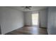 Cozy bedroom showcasing wood-look floors and a bright window with natural light at 13816 N 103Rd Ave, Sun City, AZ 85351