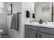 Well-lit bathroom vanity with modern fixtures and a clean design at 14377 W Alameda Rd, Surprise, AZ 85387