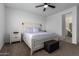 Relaxing main bedroom with a ceiling fan, and stylish furnishings at 14377 W Alameda Rd, Surprise, AZ 85387