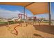 Shaded community playground with swings, slide, and climbing equipment at 14377 W Alameda Rd, Surprise, AZ 85387